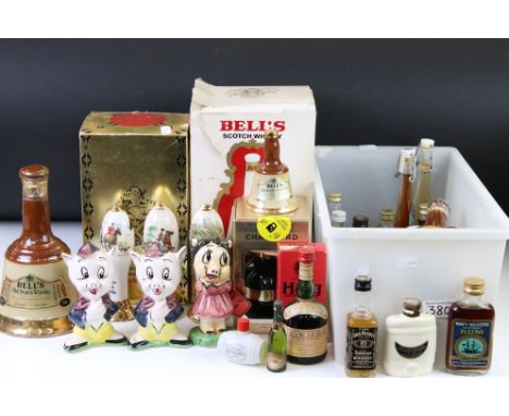 A collection of bottled alcohol to include Dimple Whisky, Bell's Whisky in ceramic Wade Bottles together with a selection of 
