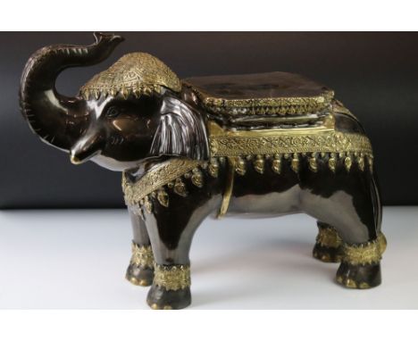 Patinated spelter elephant seat / stool with applied brass decoration in the Indian style, 41cm H 