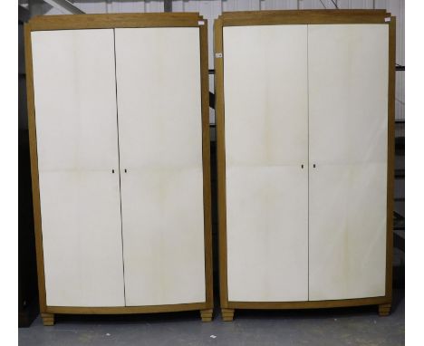 A substantial pair of oak cabinets, the doors and side panels layered in shagreen, the interiors fitted with shelves, drawers