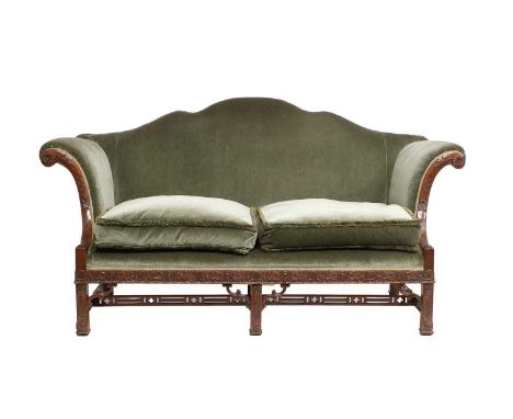 A George III Carved Mahogany Chippendale-Style Two-Seater Sofa, 19th century, covered in green velvet, the show frame with sc