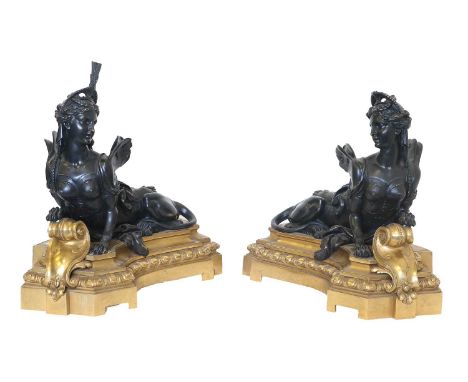 A Pair of Gilt and Patinated Bronze Figural Andirons, in Louis XVI style, as sphinxes on curved architectural bases cast with
