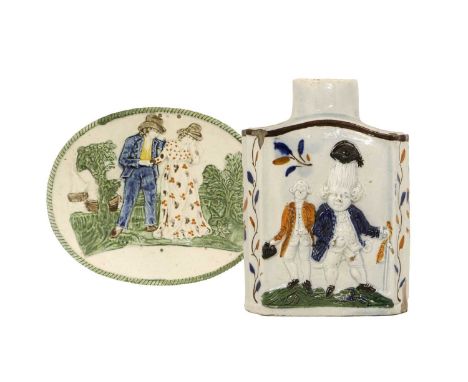 A Prattware Oval Plaque, circa 1800, moulded and painted with the Sailor's Farewell within a gadrooned border15.5cm wideA Sim