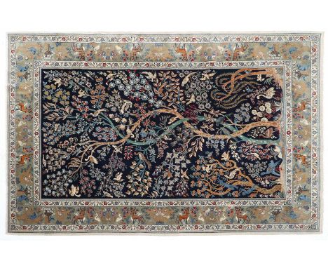 Kurk Kashan Carpet Central Iran, circa 1970 The deep indigo field with tree of life, birds and plants enclosed by dove grey b