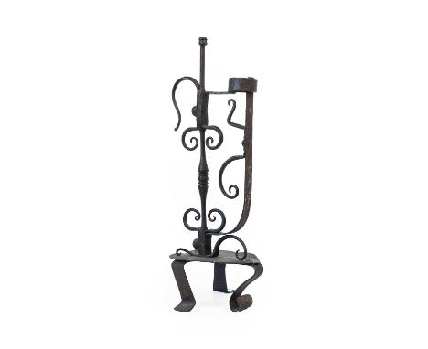 A Wrought Iron Rush Light Holder, late 18th/early 19th century, with central knopped column flanked by scrolls and with ring 