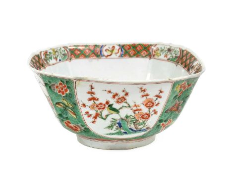 A Chinese Porcelain Bowl, Kangxi, of canted square form, painted in famille verte enamels with figures in fenced gardens and 