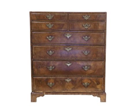 A George II Figured Walnut, Boxwood and Ebony-Strung Straight-Front Chest of Drawers, mid 18th century, the four short over f