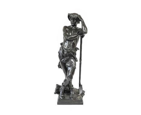 After Eugene Marioton (1854-1933): A Bronze Figure of a Farmhand, standing leaning on his scythe, a sheaf of corn at his feet