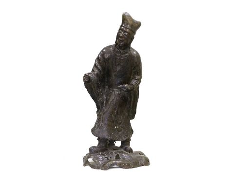 A Chinese Bronze Figure of a Scholar, 19th century, standing in flowing robes on a mound base80cm highLeaf detached from his 
