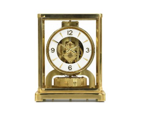 A Brass Atmos Clock, signed Jaeger LeCoultre, 20th Century, case with five glass panels, chapter ring with Arabic and dagger 