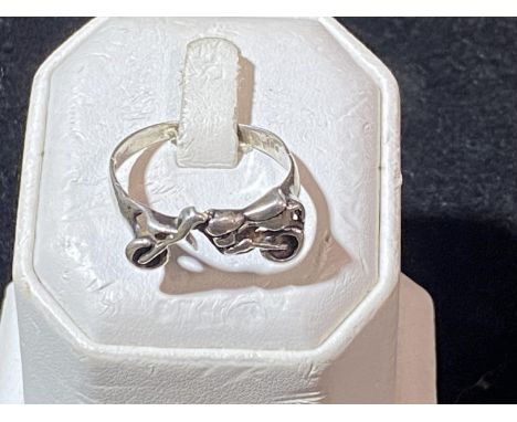 A vintage hallmarked silver ring with motorbike motif