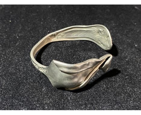 A Lashar silver torque bangle made from cutlery