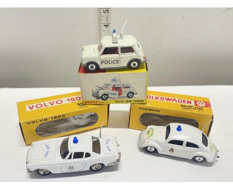 Two boxed Metosul boxed police car die-cast models and one other Dinky