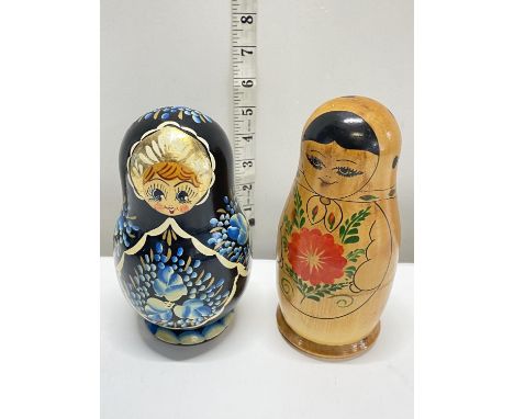 Two vintage wooden Russian nesting dolls