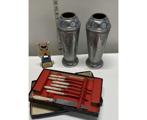 Two antique metal vases, cased set of cutlery and a vintage Micky Mouse child's toy