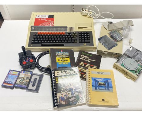 A vintage BBC Master computer console in working order (space bar needs a little attention), comes with disc drive, books, ta