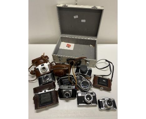 A aluminium flight case with contents of assorted vintage camera (untested)