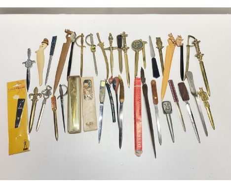 A large collection of assorted vintage paper knives and letter openers