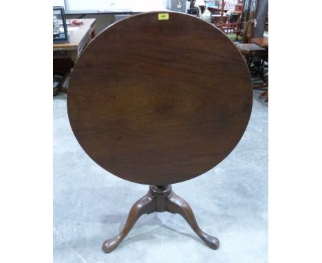 A 19th century mahogany tripod breakfast table, the one piece snap-top on acanthus carved column. 33' diam.