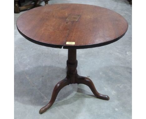 A 19th century oak tripod table on ring turned column. 27' diam.