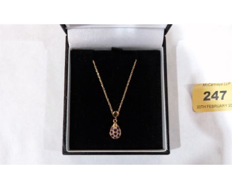 A 9ct amethyst set pendant on 9ct necklet chain. 1.6g gross