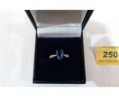 A 9ct ring set with a pear shaped tourmaline, with diamond set shoulders. 2.3g gross. Size O