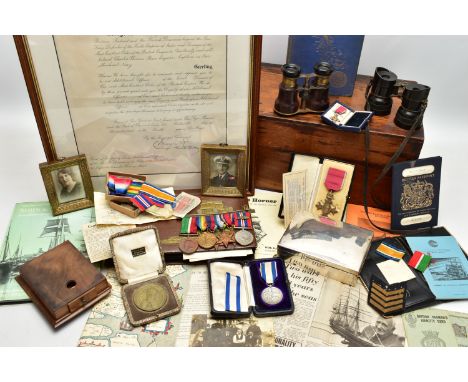 A COMPLETE ARCHIVE OF MEDALS PHOTOS AND EPHEMERA INC NAVAL ITEMS TO A BRAVE CAPTAIN IN THE MERCHANT NAVY, who saw action in b