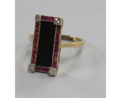 An Austro-Hungarian yellow metal, black onyx, ruby and diamond set tablet ring, size K.