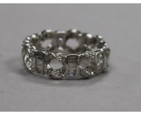 A modern 18ct white gold and diamond set pierced 'eternity' ring, size M.