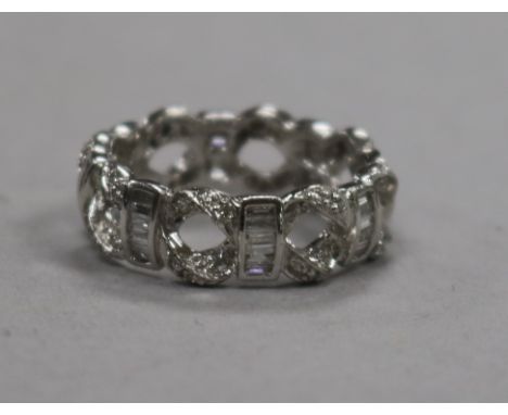 A modern 18ct white gold and diamond set pierced 'eternity' ring, size M.