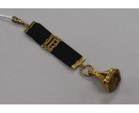 A 9ct gold and citrine set fob seal, on a 9ct gold mounted sash pendant.