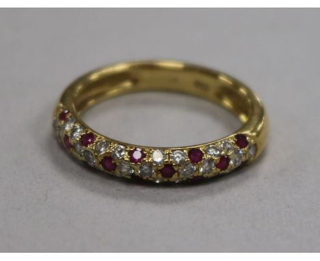 A modern 18ct gold and pave set diamond and ruby half hoop ring, size N.