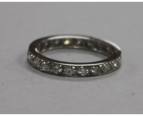 A white metal and diamond set full eternity ring, size M.