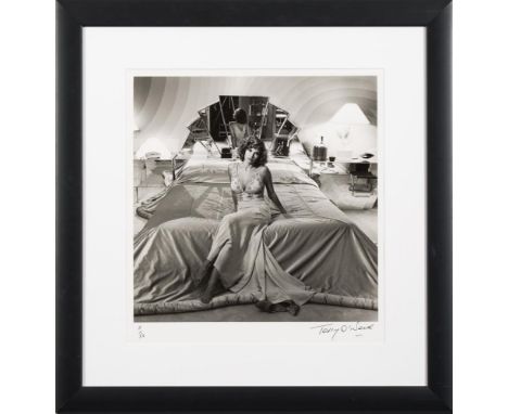 * Terry O'Neill [b.1938]- Raquel Welch,:- gelatine silver print, signed and numbered 11/50 image 35 x 35cm.