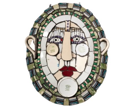 *Cleo Mussi (b.1965) a ceramic mosaic 'Platter Face 3': the oval visage formed from broken domestic china, signed verso and d
