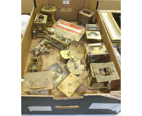 A collection of clock spares, including seven brass carriage clock cases with part-movements, etc.