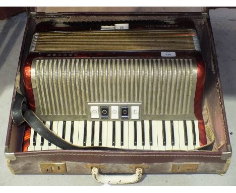 A Hohner Carena IIIM piano accordion, in case.
