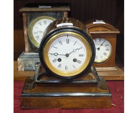 A brass drum timepiece, 9cm diameter, enclosed within wooden case, a stained wood case striking mantel clock and a slate and 