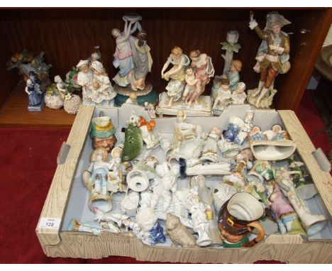 A collection of late-19th and 20th century ceramic and bisque figure ornaments, many damaged.