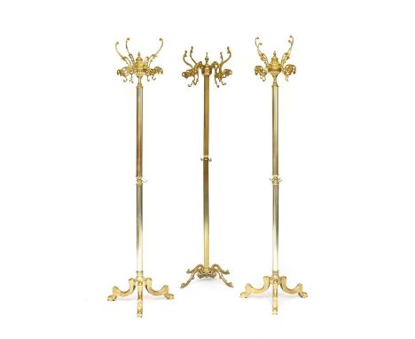 A Pair of Brass and Gilded Metal Four-Branch Hat and Coat Stands, modern, with scrolled hooks above reeded column supports, o