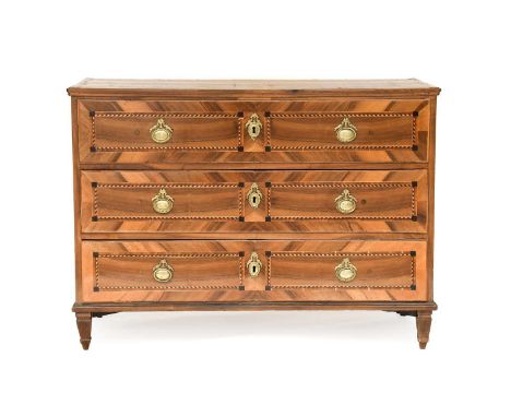 An 18th Century Walnut and Parquetry Decorated Commode, the crossbanded top above three pine-lined drawers, on square taperin