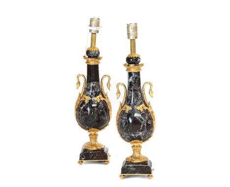 A Pair of French Gilt Metal Mounted Marble Lamp Bases, in Louis XVI style, of pear form, the swan neck handles with leaf and 