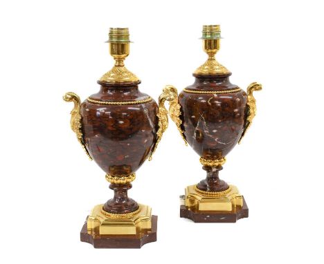 A Pair of Gilt Metal Mounted Rouge Marble Lamp Bases, in Louis XVI style, of ovoid form with leaf-scroll handles, circular so