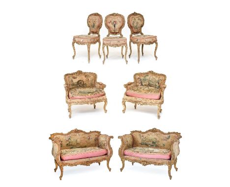 A Late 19th Century Venetian Carved Giltwood Ten Piece Drawing Room Suite, covered in original floral needlework fabric, comp