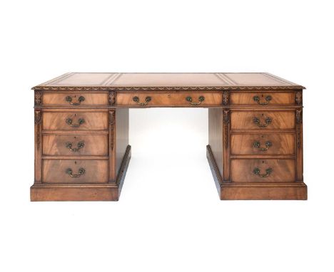 A Carved Mahogany Double Pedestal Desk, late 19th/early 20th century, in George III style, the light brown and gilt inset lea