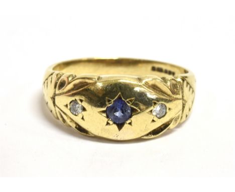 A 9ct GOLD SAPPHIRE AND DIAMOND GYPSY RING The ring set with a central star set blue sapphire with a tiny star set Diamond ea