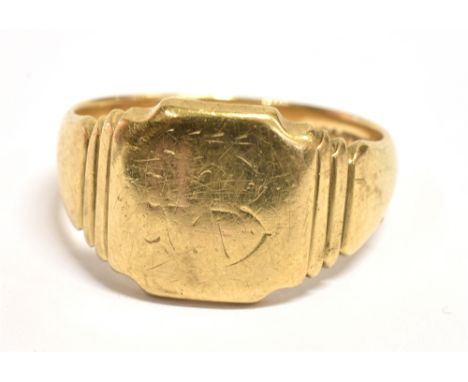 A 9CT GOLD SIGNET RING  the ring with light scratch marks (initial?) to the bezel and ribbed shoulders, the shank marked J.H&