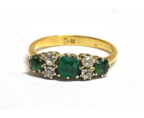 A MARKED 18CT EMERALD AND DIAMOND DRESS RING ring size M, weight 2.9grams