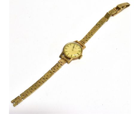 A LADY'S VINTAGE WRISTWATCH  on a gold strap, the champagne dial fitted with gilt batons and indexes with Omega logo and name