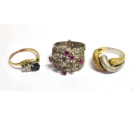 THREE RINGS  Comprising a sapphire and diamond crossover ring on a yellow metal shank, ring size K ½ , weight 1.7grams, a pin