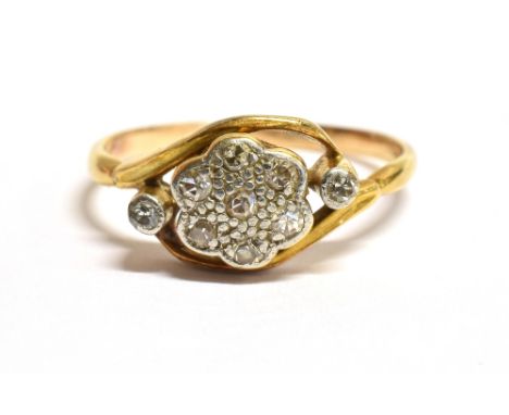 A VINTAGE DIAMOND PLAQUE RING The plaque of hexagonal curved shape, in white metal with 7 small diamonds and one each side, t